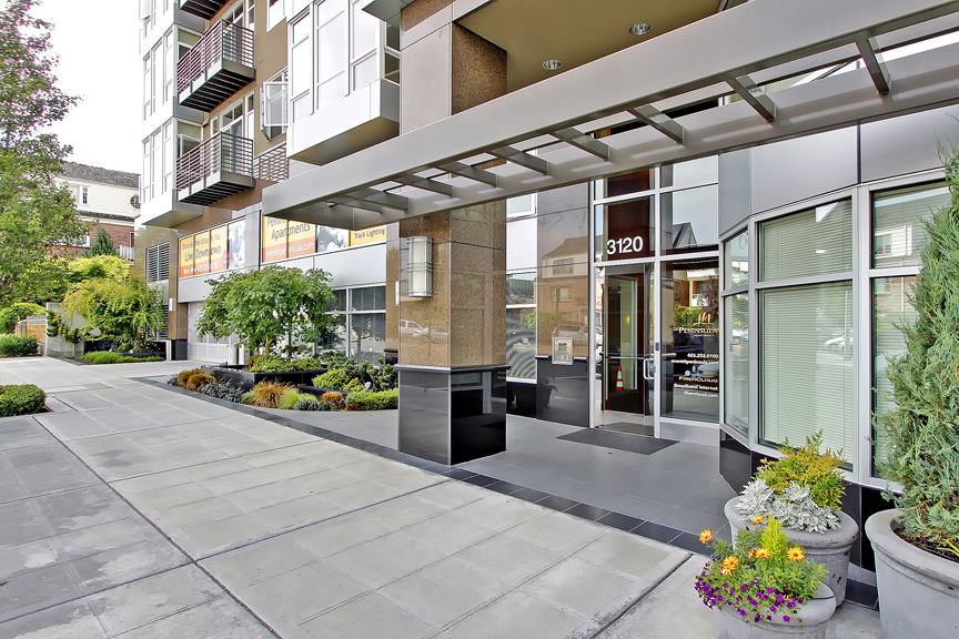 A modern building with the number 3120 on the front door.